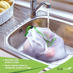 Reusable produce bags made from plastic-free mesh and being washed in the sink.