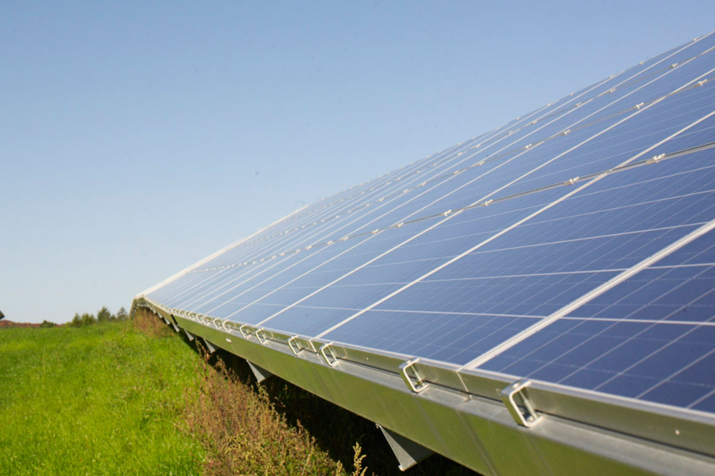 large array of solar panels financed by RE Royalties Green Bonds